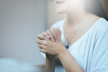 Happy asian woman with hand in praying position,Female prayer hands clasped