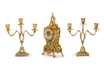 Vintage gold watch with candelabra on white background