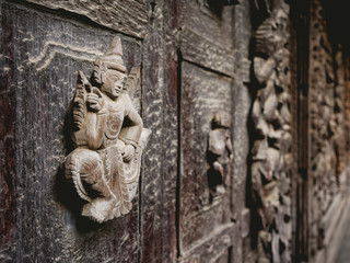 Wall teak carvings close up Buddhist myths element Art decoration Shwenandaw Monastery in Mandalay Myanmar