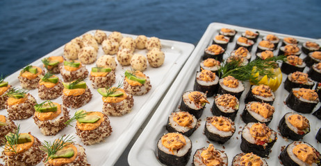 Sushi maki with blue sea as a backdrop
