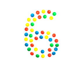 Children's numbers laid out from a multi-colored mosaic figure number 6, alphabet