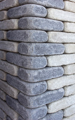 Modern brown brick column, background texture, closeup, decoration