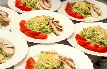 Several servings of cabbage salad and ham with tomato snack, preparation for a banquet, restaurant