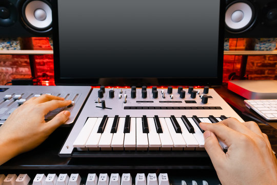music producer hands arranging a song in sound studio. recording concept