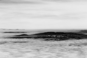 Fog filling a valley in Umbria (Italy), with layers of mountains and hills