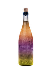 Old bottle of colorful liquid, covered in dust