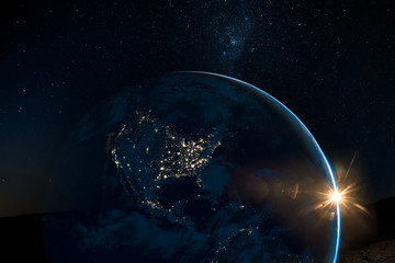 Night view of north America from the satellite to the glowing city lights on the sunrise from the east. Elements of this image are furnished by NASA.