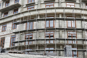new building under construction, scaffolding and concrete