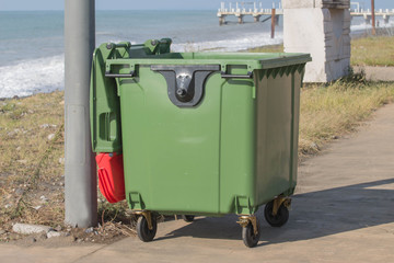 trash box near the sea beach. Littering the beach and the sea