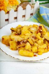 Fried potatoes on the dinner table.