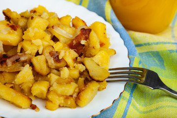 Fried potatoes on the dinner table.