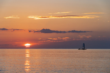 (石垣島)夕焼けの海と船