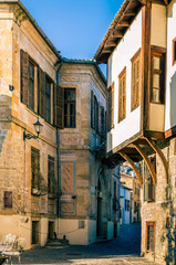 Picturesque narrow alley and neoclassical buildings, characteristics in the  old town of Xanthi.