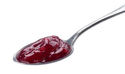 Spoon of red jam isolated on white background