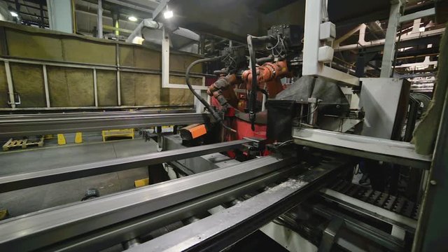 Welding robot, the process of welding a metal profile.