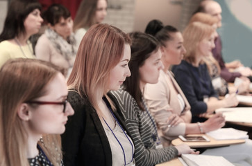 group of business people with clipbord sitting at the meeting