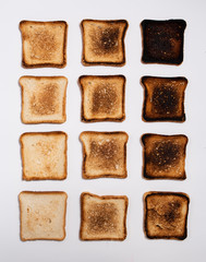 Bread toasts of different types on a white background