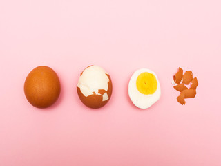 Cleaning boiled eggs from the shell in 4 stages on a pink background