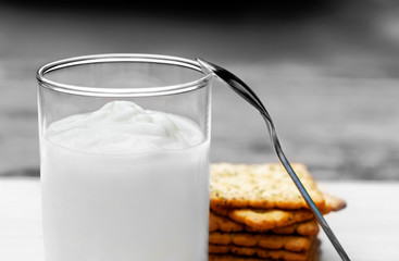 Yogurt and cookies is a healthy breakfast. Yogurt made from milk fermented by added bacteria, often sweetened and flavored.