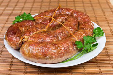 Baked homemade turkey sausage curtailed by a rings close-up