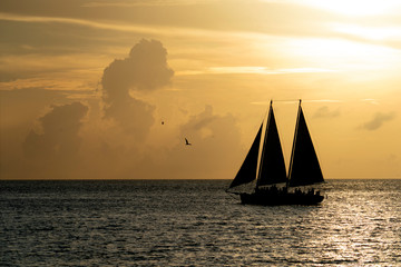 beautiful sunset with sailboat silhouette