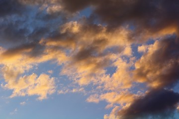 beautiful toned sun colored clouds on the sky for using in design as background.