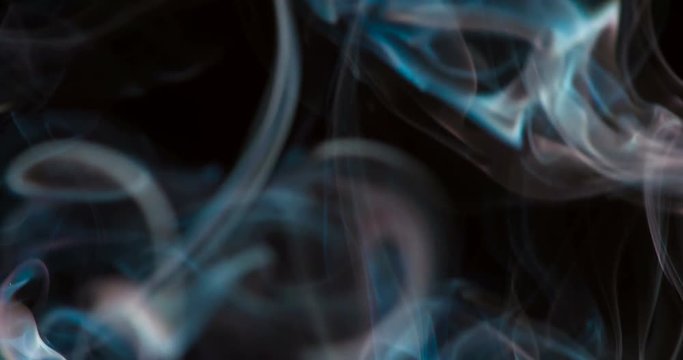 Cold Gas Mist. A jet of blue smoke slowly rises up forming an ornate cloud. Filmed at a speed of 120fps