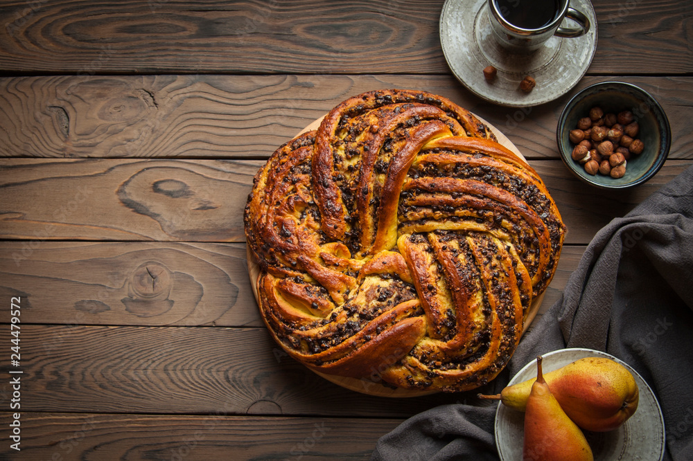 Wall mural creative yeast dough cake stuffed with pear, chocolate and hazelnuts.