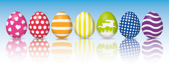 Holiday banner, colorful easter eggs with white patterns, reflection on white surface, sky background