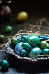 Easter background with painted Easter eggs in vintage style over dark background