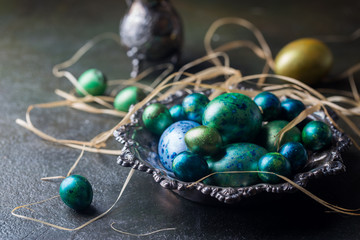Easter background with painted Easter eggs in vintage style over dark background
