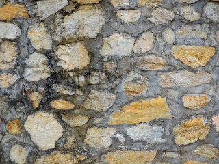 Seamless texture brown stone wall. Seamless background.