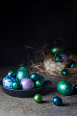 Easter background with painted Easter eggs in vintage style over dark background