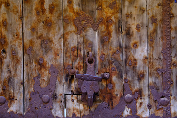 old wooden rusty metal door with lock, Backgrounds Textures wood door, Ancient architecture doornail and door knocker