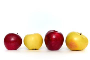 red and yellow apples on white background