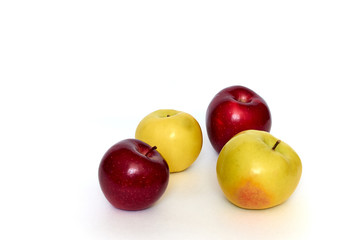red and yellow apples on white background