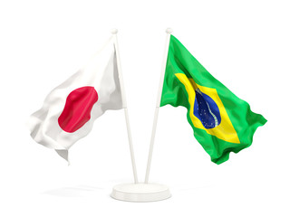 Two waving flags of Japan and brazil