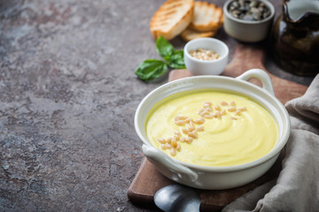 Vegetarian white cauliflower cream soup in a white bowl