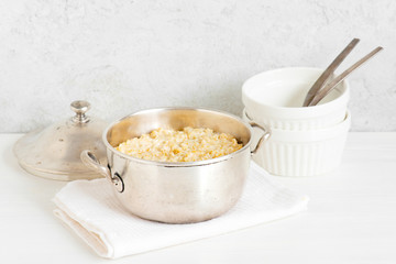 Classical oatmeal porridge on the white table