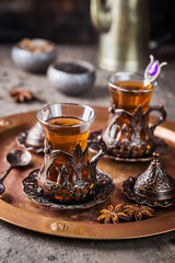 Turkish tea in traditional glass on tray closeup