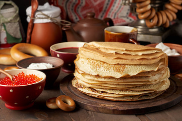 Shrovetide Maslenitsa Butter Week festival meal. Stack of russian pancakes blini