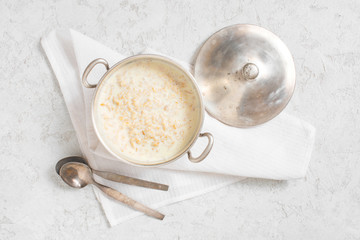 Classical oatmeal porridge on the white table