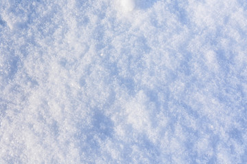 Texture of the white fluffy snow for background