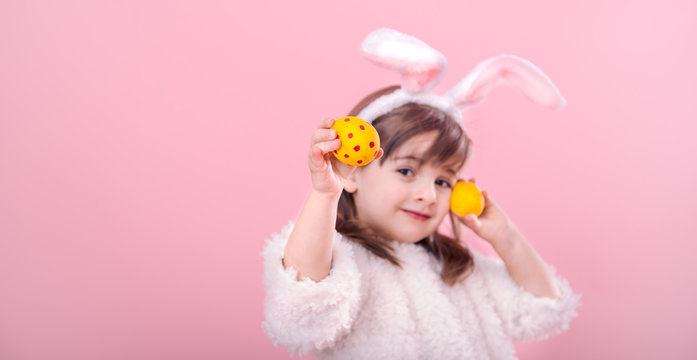 Portrait of a little girl with Bunny ears w Easter eggs