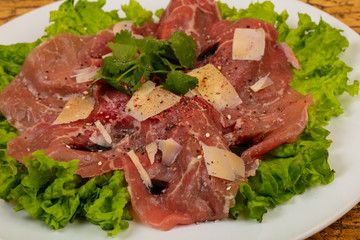 Beef carpaccio with parmesan cheese