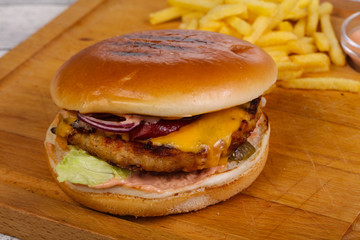 Burger with chicken, cheese and red onion