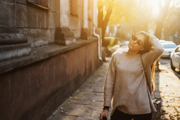 Street portrait of young beautiful fashionable woman