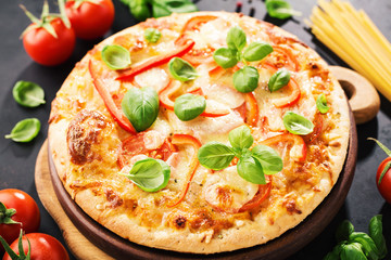 Tasty vegetarian pizza on dark background