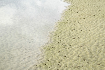 Beautiful wave on the beach, clear water, white sand in your holliday at andaman sea.