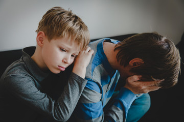 sad child with stressed father, family problems, sorrow